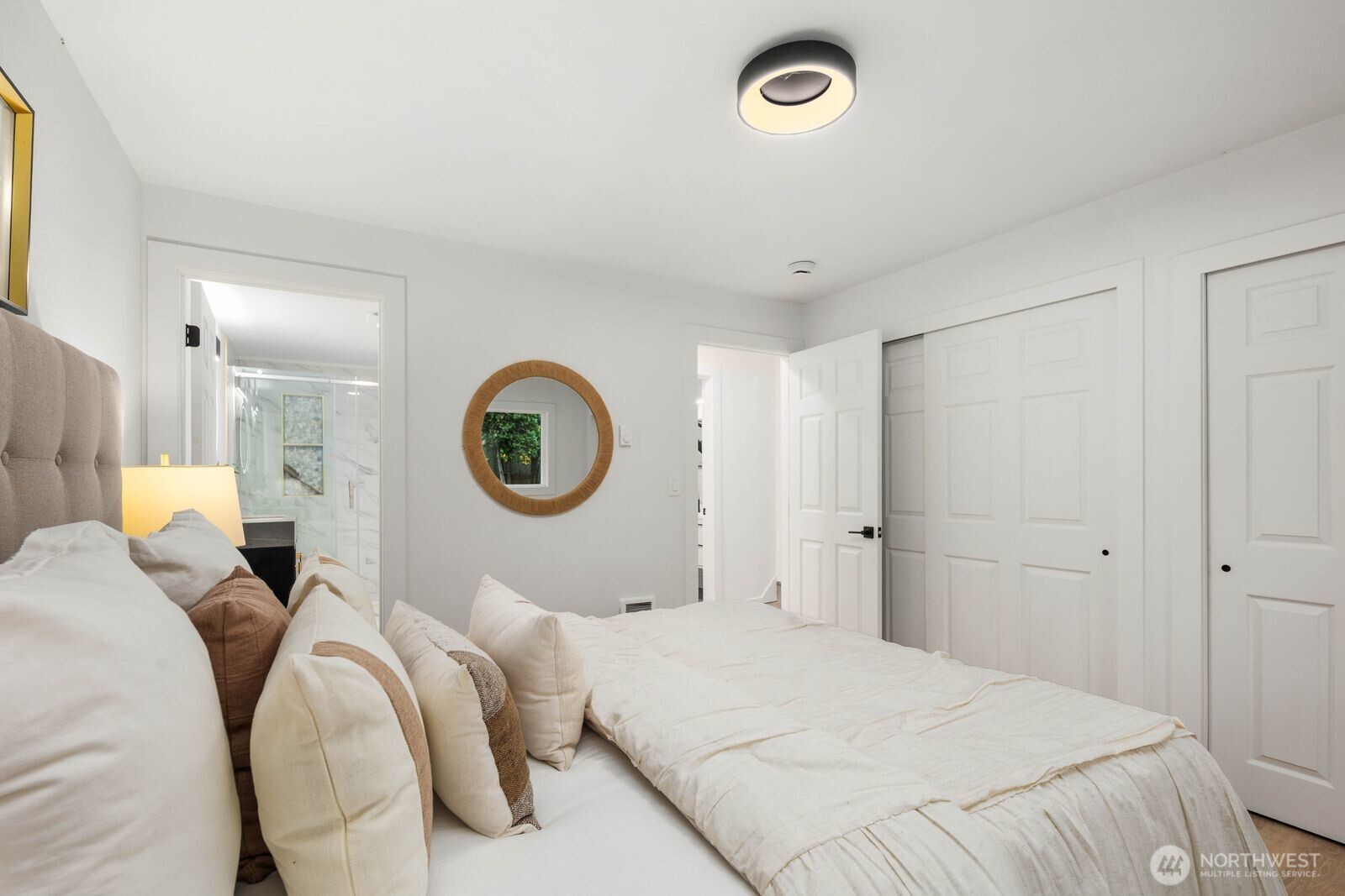 14866 154th Place Southeast Renton, WA 98058 - Photo 24 of 36 a bedroom with a bed and a lamp