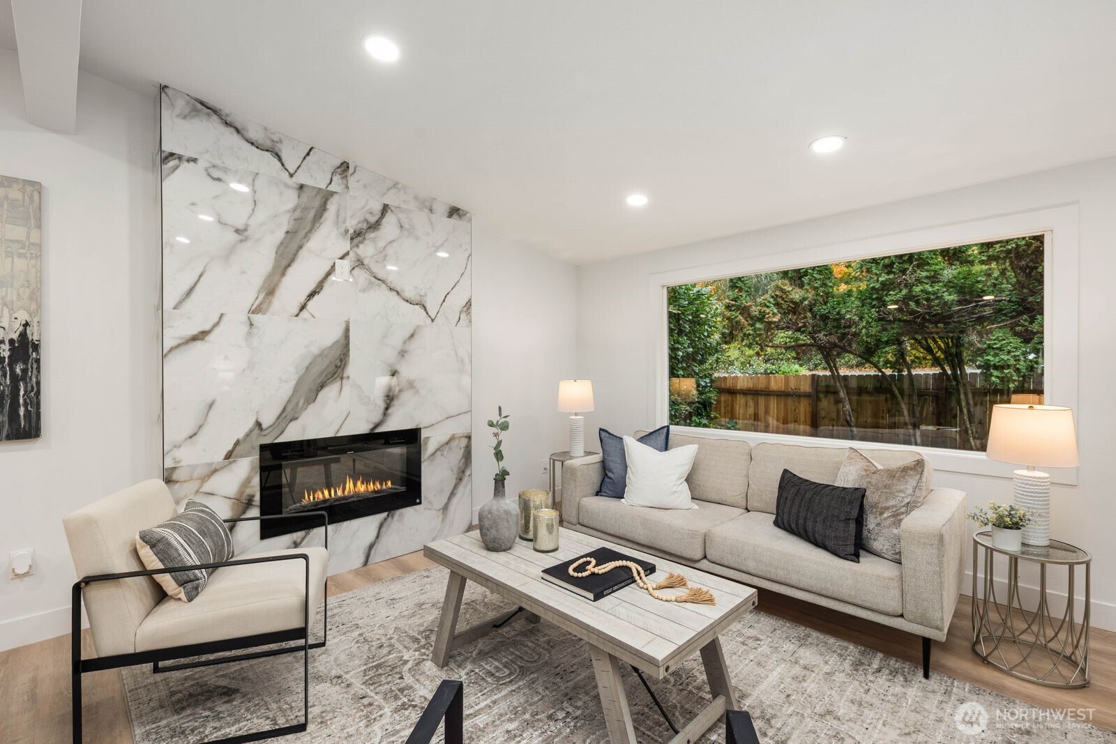 14866 154th Place Southeast Renton, WA 98058 - Photo 6 of 36 a living room with furniture a flat screen tv and a fireplace