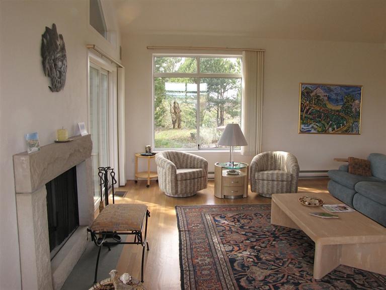 16 Cormorant Road Truro, MA 02666 - Photo 13 of 21 a living room with furniture and a fireplace