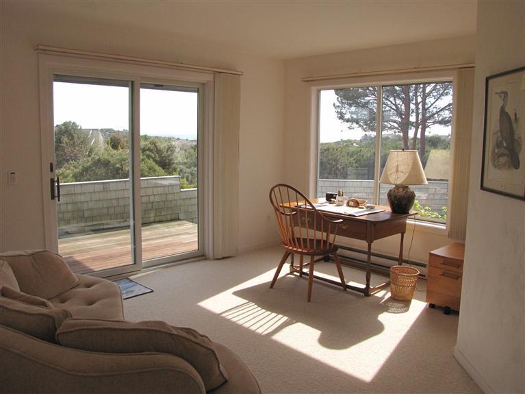16 Cormorant Road Truro, MA 02666 - Photo 17 of 21 a living room with furniture and a large window