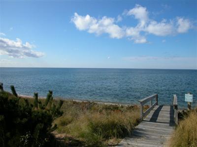 16 Cormorant Road Truro, MA 02666 - Photo 3 of 21 a view of a lake with a yard