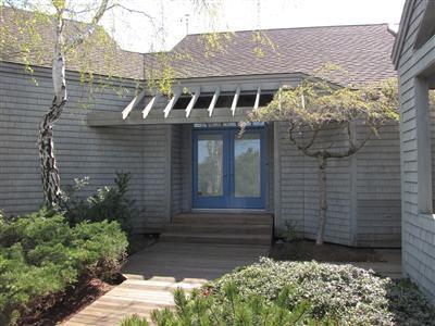 16 Cormorant Road Truro, MA 02666 - Photo 7 of 21 a front view of a house with a yard