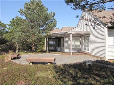 16 Cormorant Road Truro, MA 02666 - Photo 9 of 21 a front view of a house with a yard