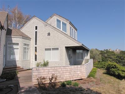 16 Cormorant Road Truro, MA 02666 - Photo 10 of 21 a front view of a house with a yard