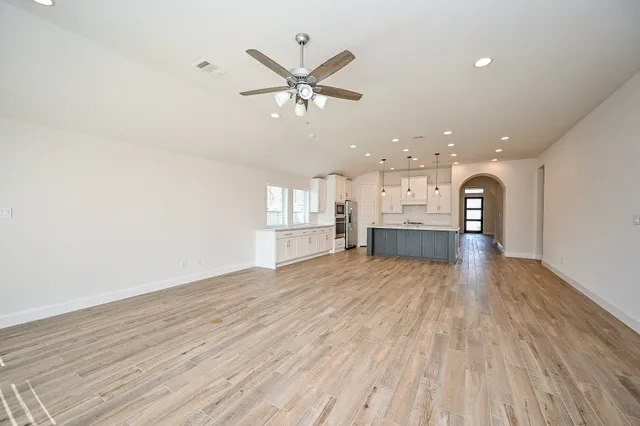 a view of a kitchen with a sink and a fireplace