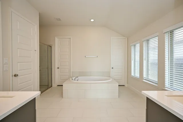 a view of an empty room with a fan