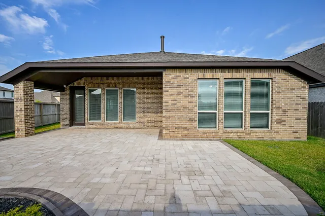 a view of a backyard of the house