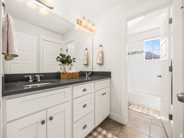 117 Ridge View Drive Elk Ridge, UT 84651 - Photo 27 of 42 Full bath with double vanity, bathtub / shower combination, and light tile patterned flooring
