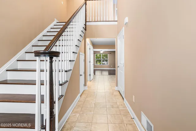 a view of a hallway with staircase