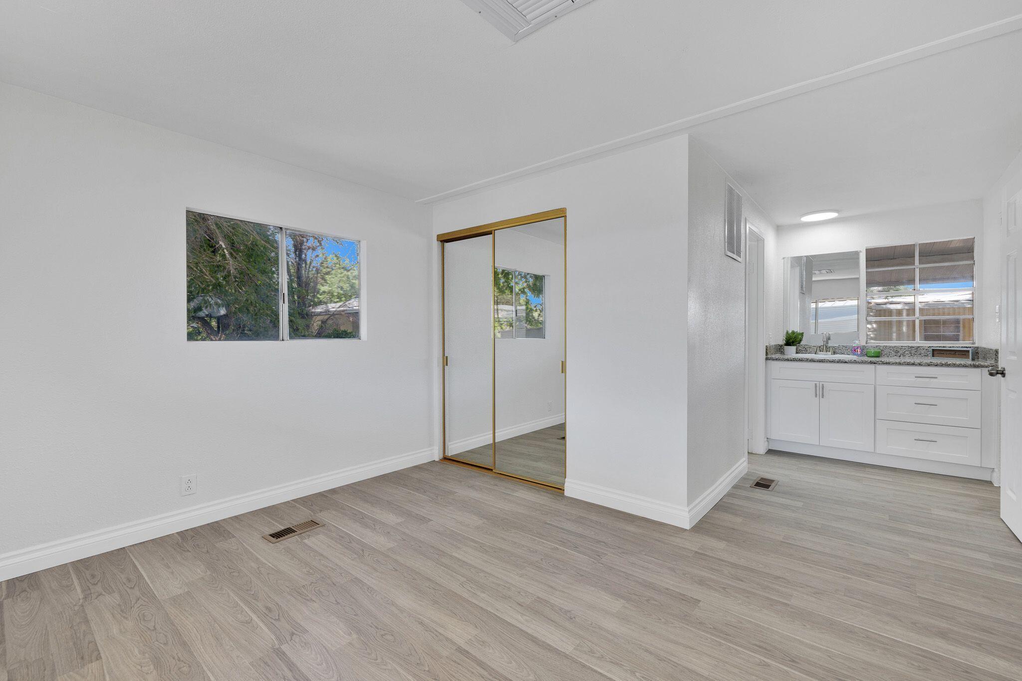 1301 East Avenue I Lancaster, CA 93535 - Photo 18 of 25 a view of a kitchen with wooden floor and electronic appliances