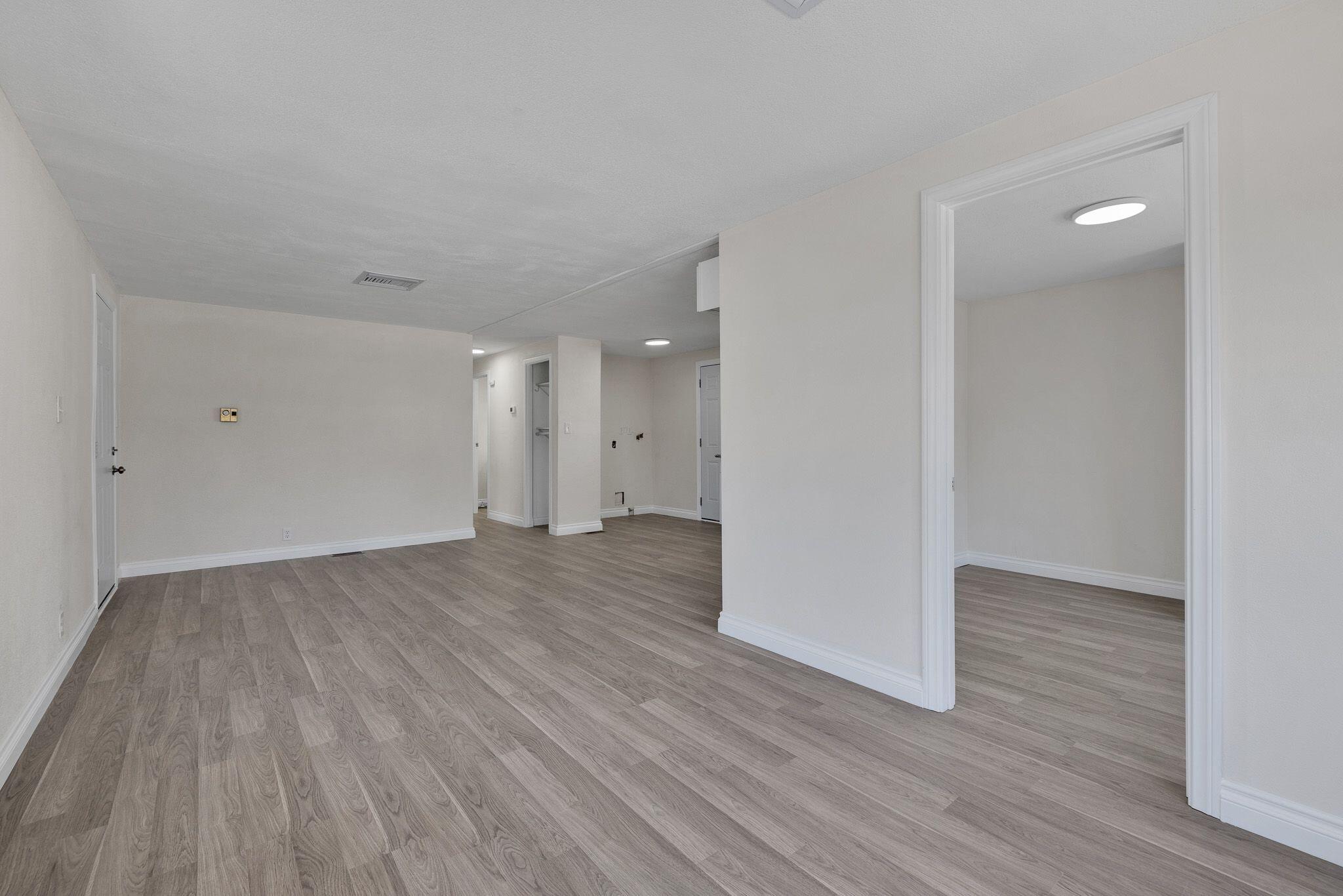1301 East Avenue I Lancaster, CA 93535 - Photo 5 of 25 a view of an empty room and wooden floor