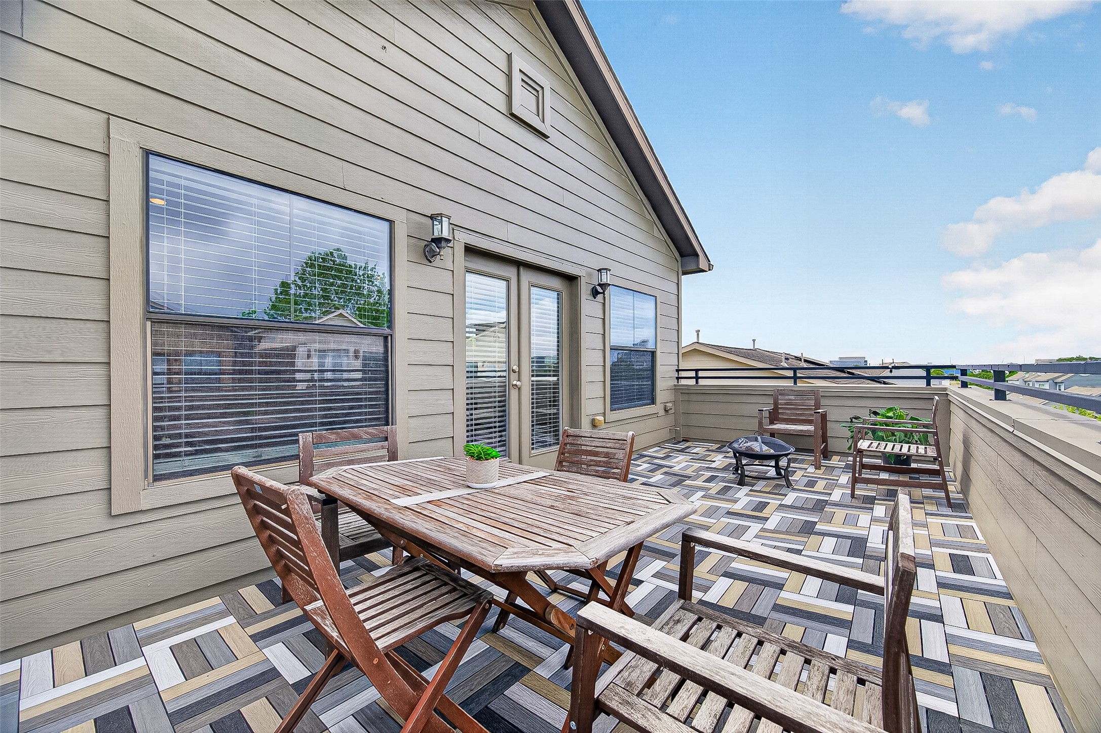 2611 Riverside Drive, Unit C Houston, TX 77004 - Photo 2 of 50 Spacious rooftop patio with stylish wood and tile flooring, offering outdoor seating and scenic views, perfect for entertaining, romantic date nights or just relaxing.