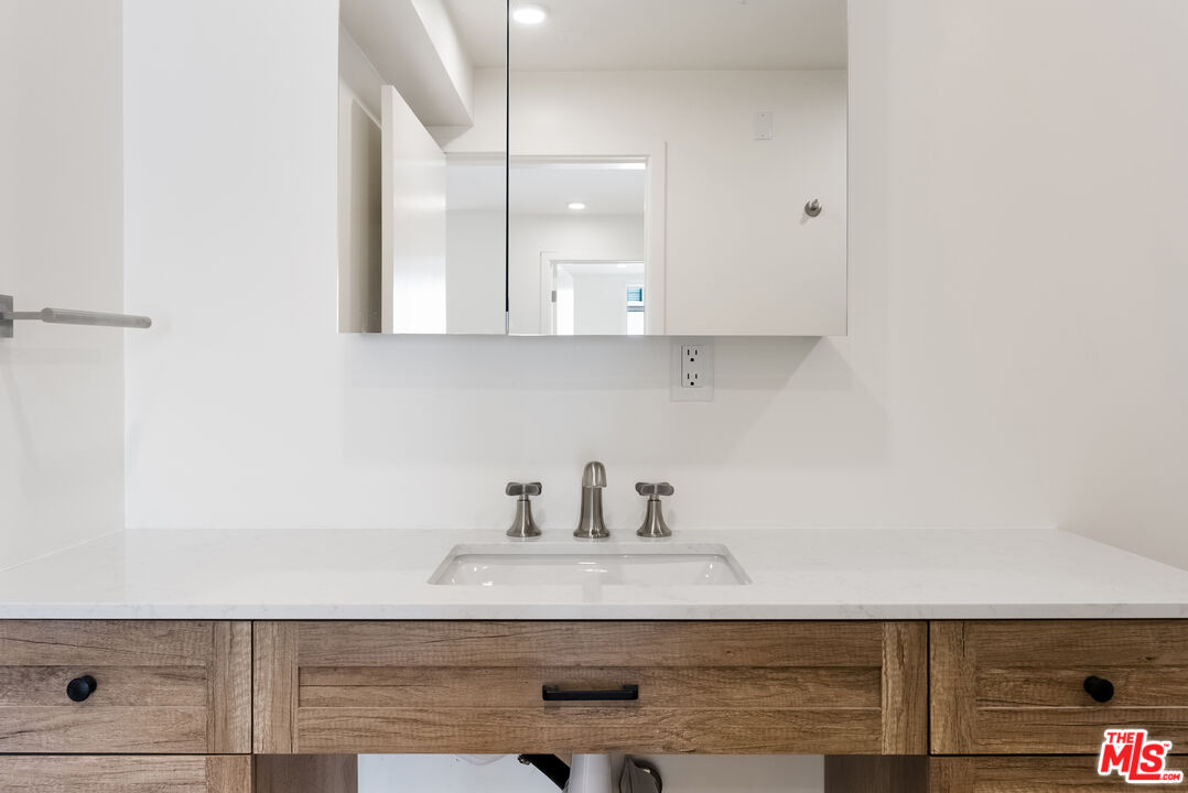 8561 Belmont Street, Unit 4 Cypress, CA 90630 - Photo 11 of 23 a kitchen with a sink and cabinets