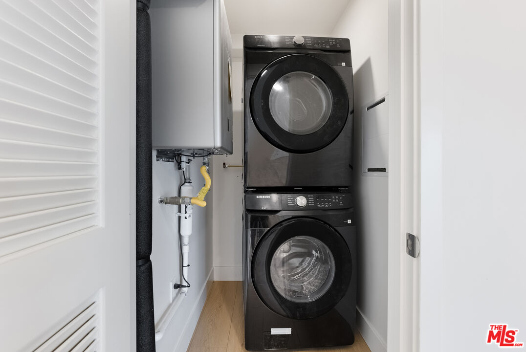 8561 Belmont Street, Unit 4 Cypress, CA 90630 - Photo 13 of 23 a view of washer and dryer in a utility room