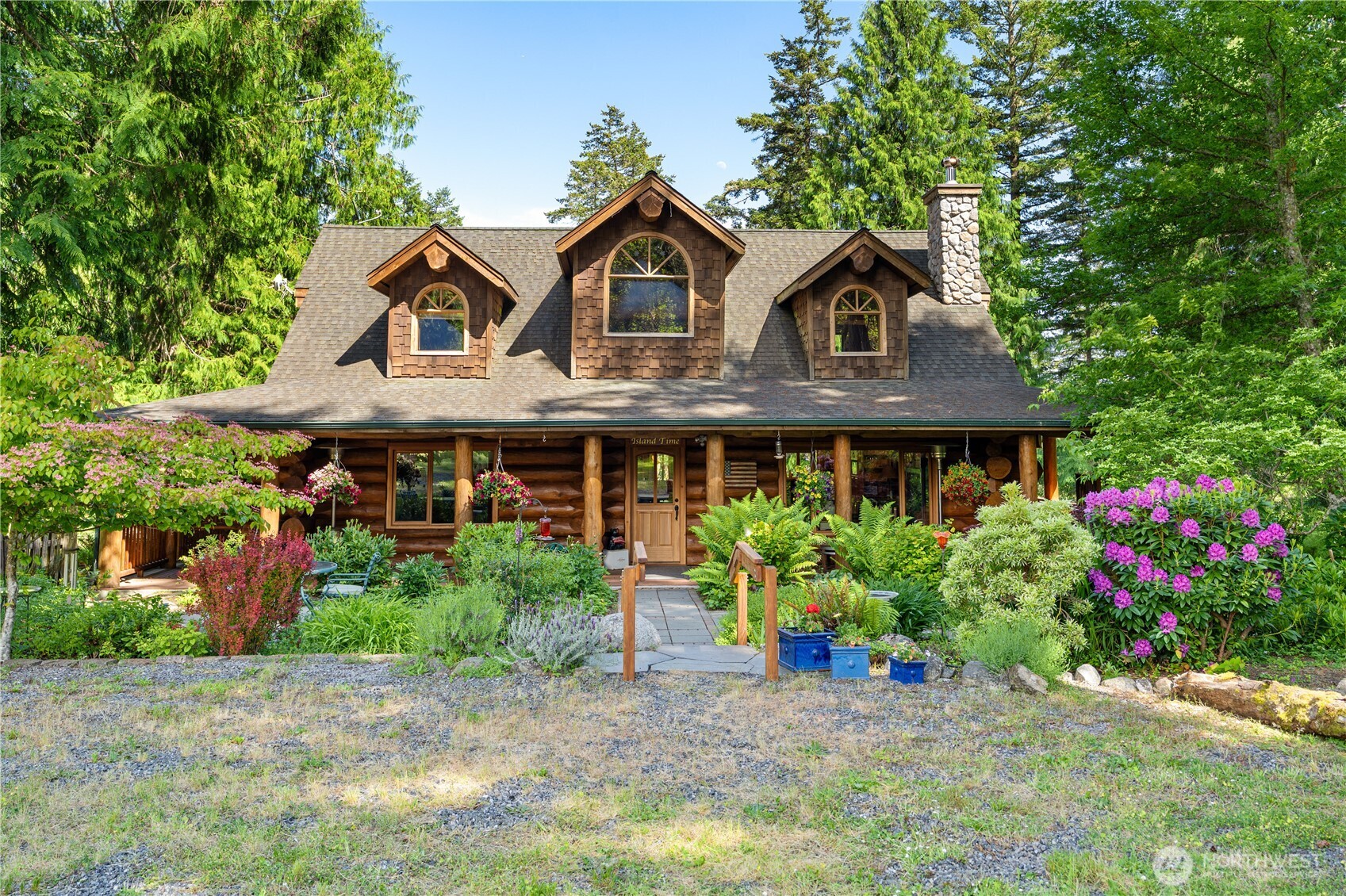 134 Sacred Moon Way Friday Harbor, WA 98250 - Photo 2 of 35 a front view of a house with a yard and trees
