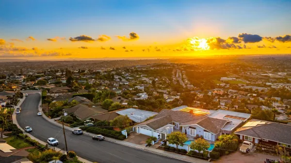 an aerial view of residential houses with outdoor space