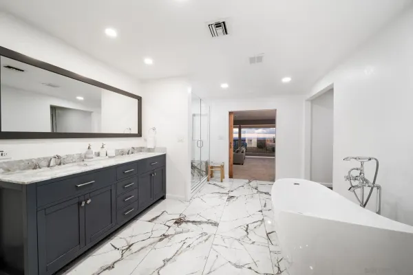 a bathroom with a bathtub and a shower
