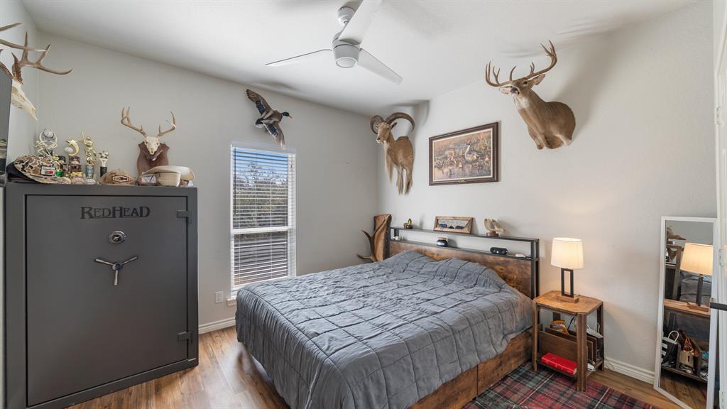101 Lighthouse Lane Mabank, TX 75143 - Photo 23 of 40 Bedroom with wood finished floors and ceiling fan