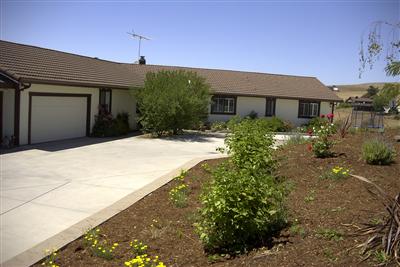 3688 Roblar Road Petaluma, CA 94952 - Photo 2 of 10 a front view of a house with a yard