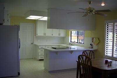 3688 Roblar Road Petaluma, CA 94952 - Photo 7 of 10 a kitchen with stainless steel appliances granite countertop a sink a stove a dining table and chairs