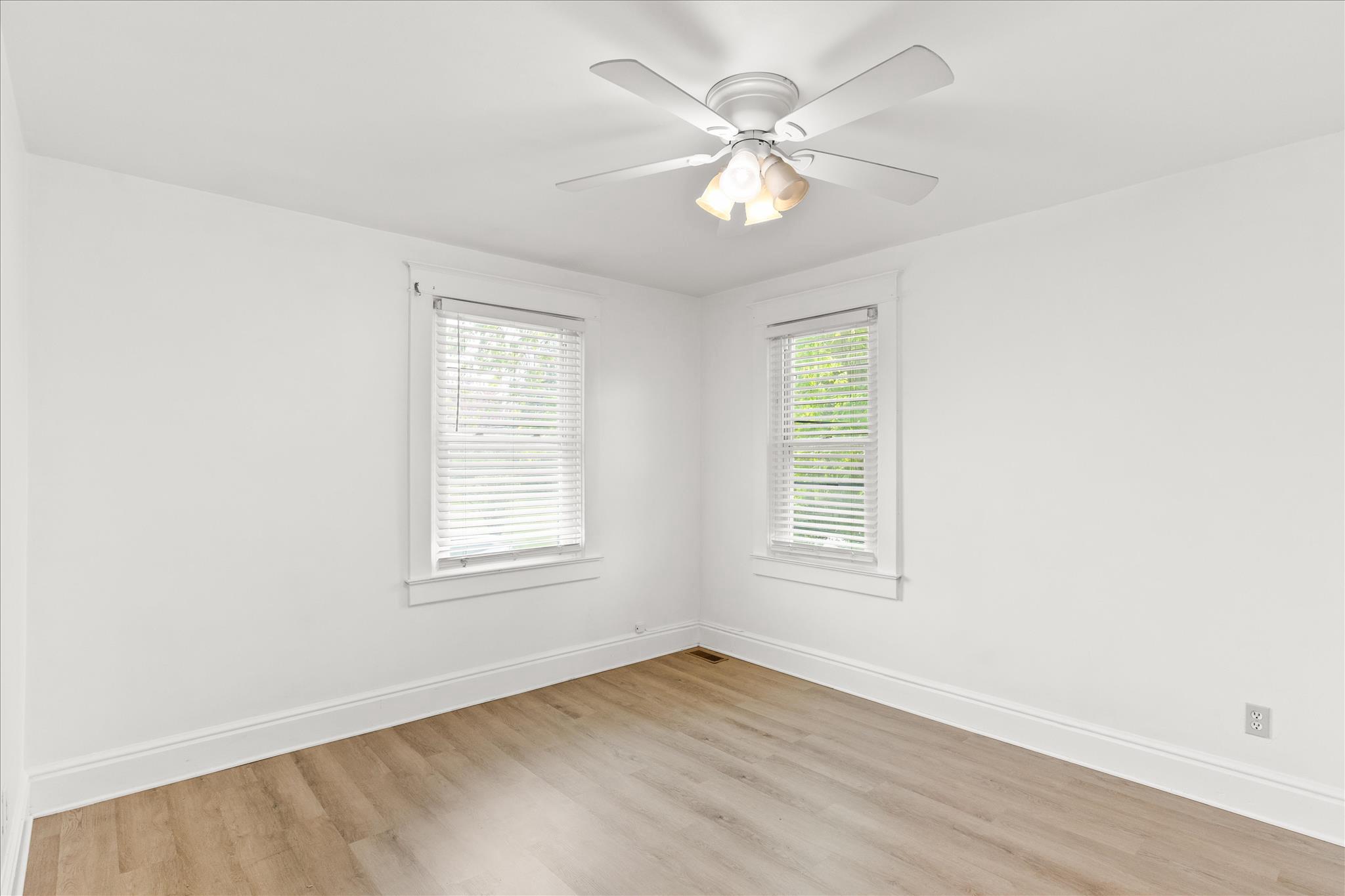 310 Hanover Road York, PA 17408 - Photo 21 of 56 an empty room with wooden floor and windows