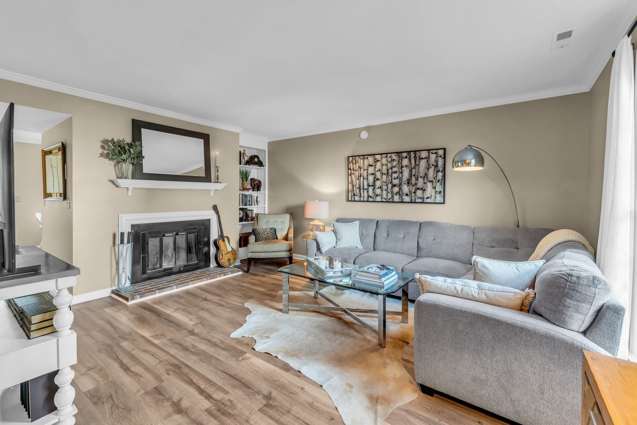 705 Fox Ridge Drive Brentwood, TN 37027 - Photo 12 of 26 a living room with furniture and a fireplace