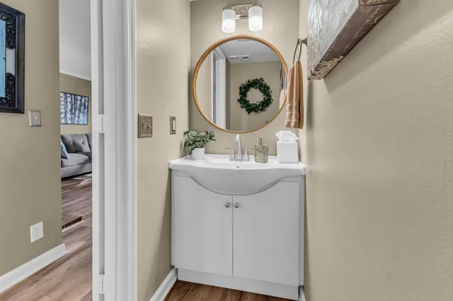 a bathroom with a sink and a mirror