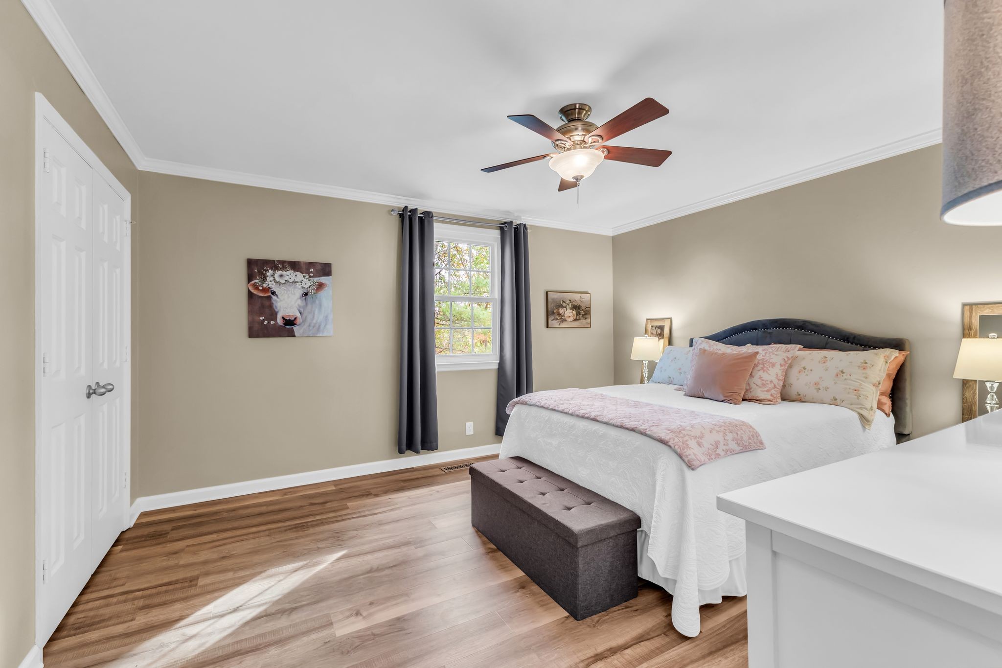705 Fox Ridge Drive Brentwood, TN 37027 - Photo 20 of 26 a spacious bedroom with a bed and a chandelier