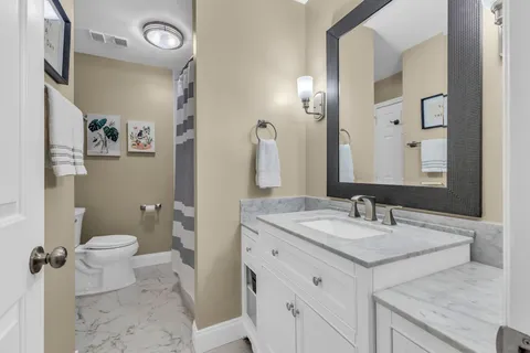 a bathroom with a bathtub and a sink