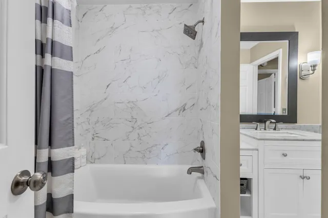 a bedroom with a bed furniture and a book shelf