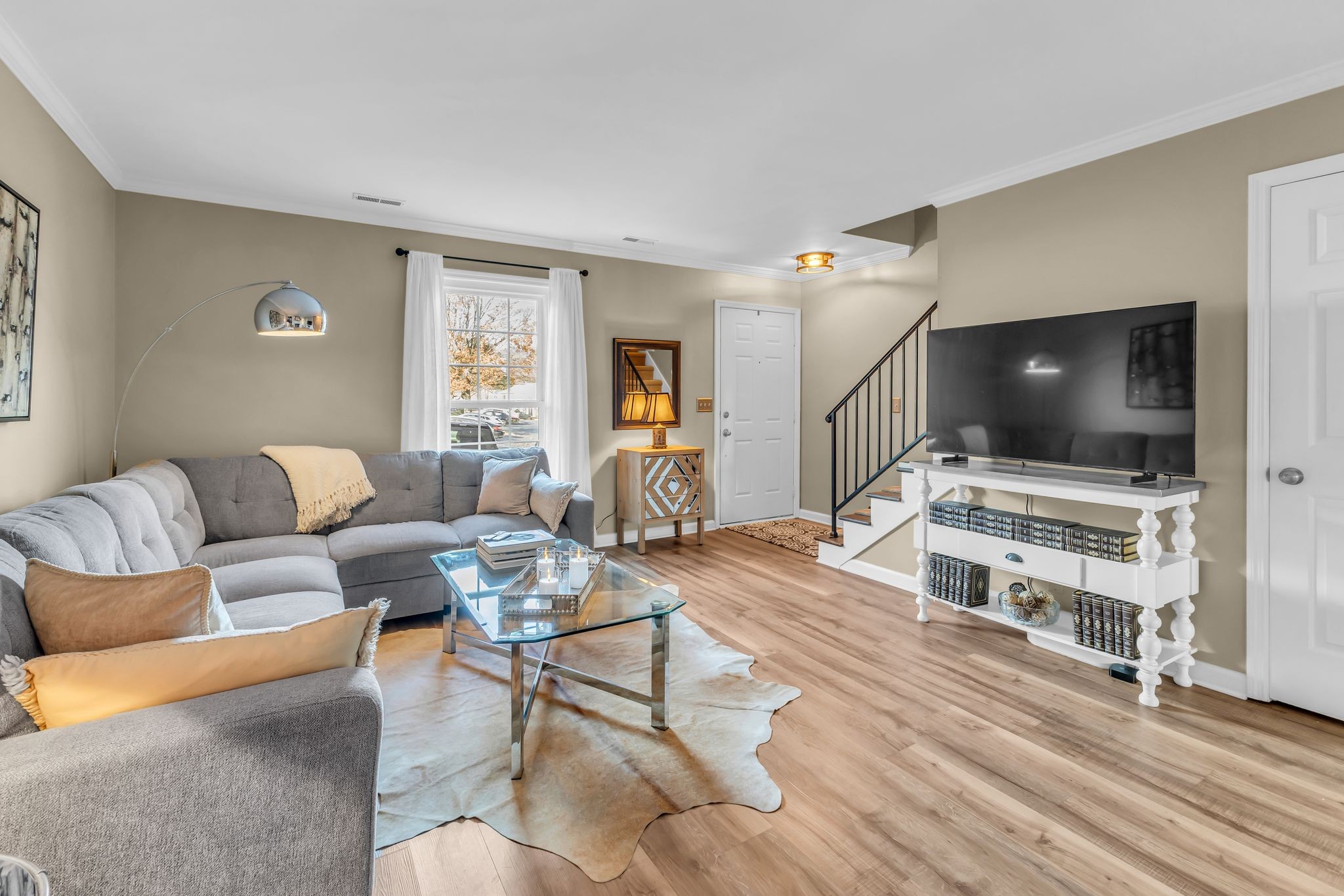 705 Fox Ridge Drive Brentwood, TN 37027 - Photo 8 of 26 a living room with furniture and a flat screen tv