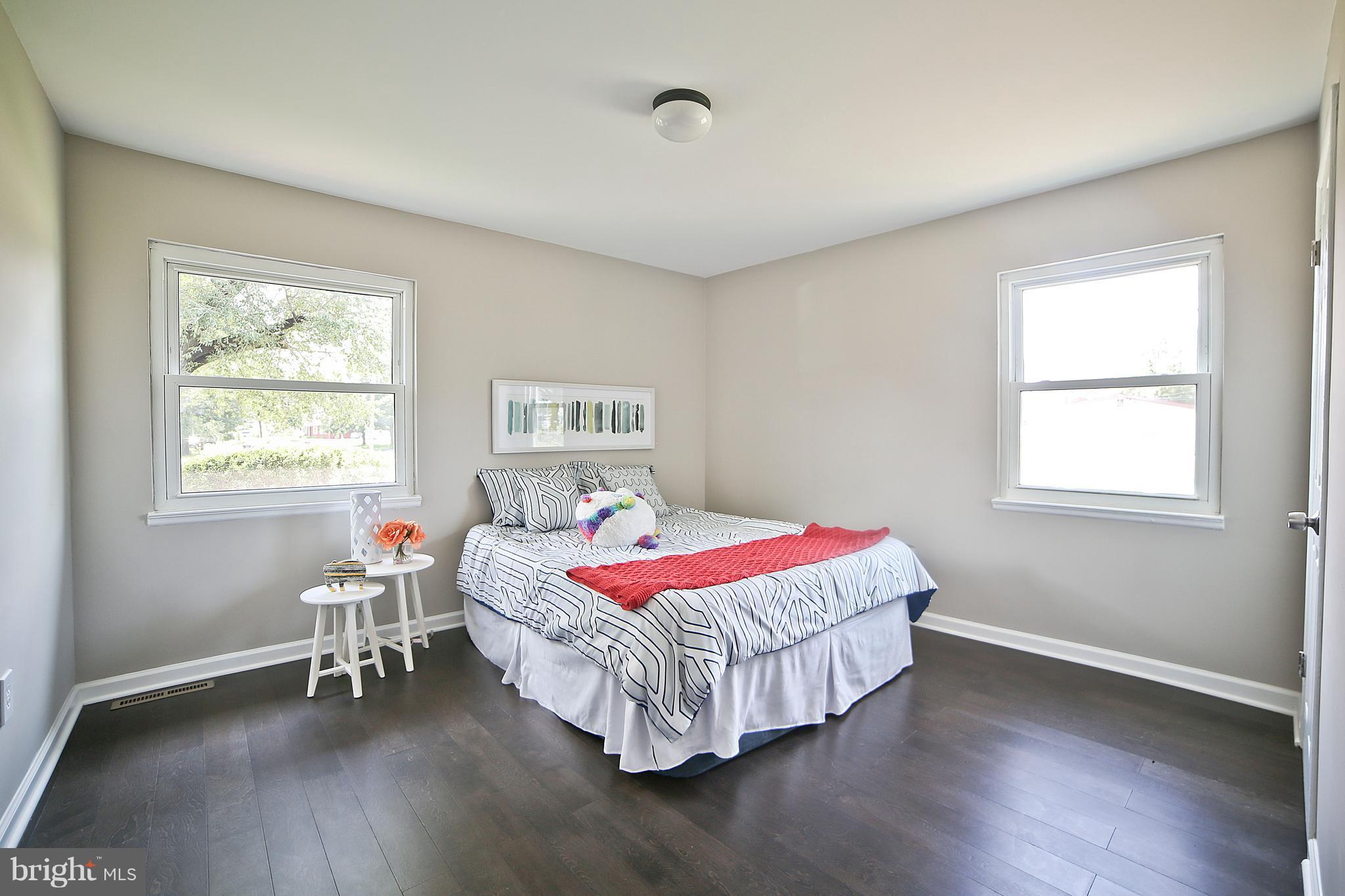 6612 Cimarron Street Springfield, VA 22150 - Photo 22 of 30 a bedroom with a bed and a window