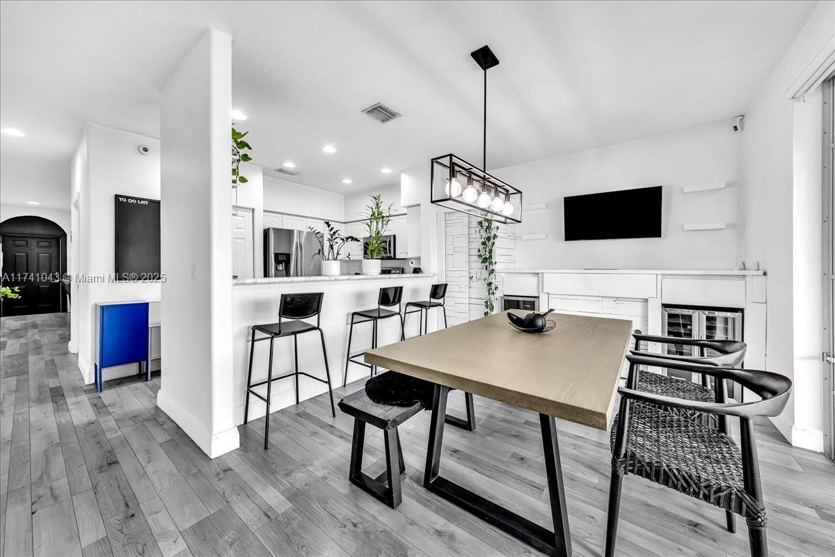 8381 Southwest 26 Th Street, Unit 103 Miramar, FL 33025 - Photo 23 of 62 a view of kitchen with cabinets table and chairs