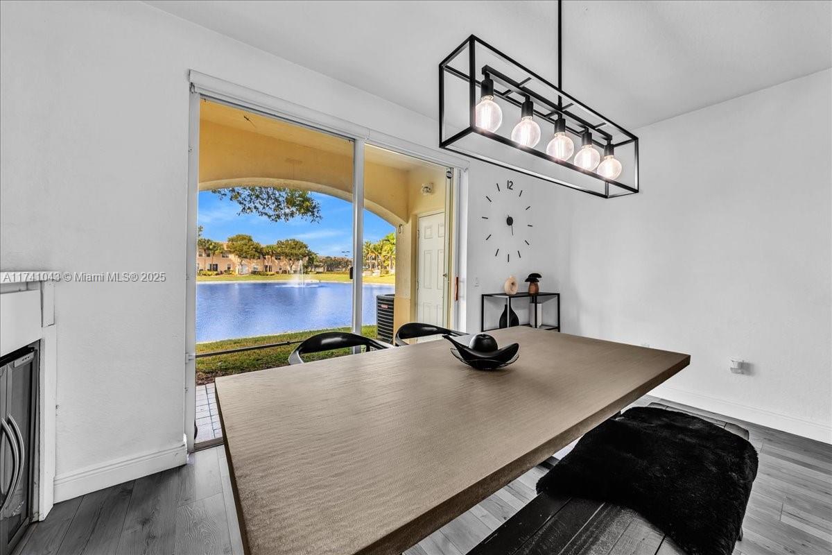 8381 Southwest 26 Th Street, Unit 103 Miramar, FL 33025 - Photo 26 of 62 a view of a room with furniture and chandelier