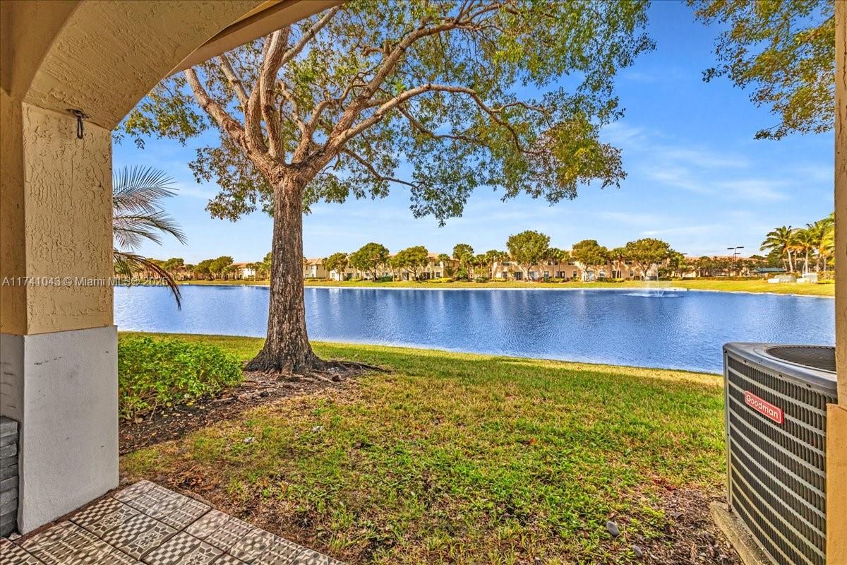 8381 Southwest 26 Th Street, Unit 103 Miramar, FL 33025 - Photo 3 of 62 a view of a lake with houses in the back