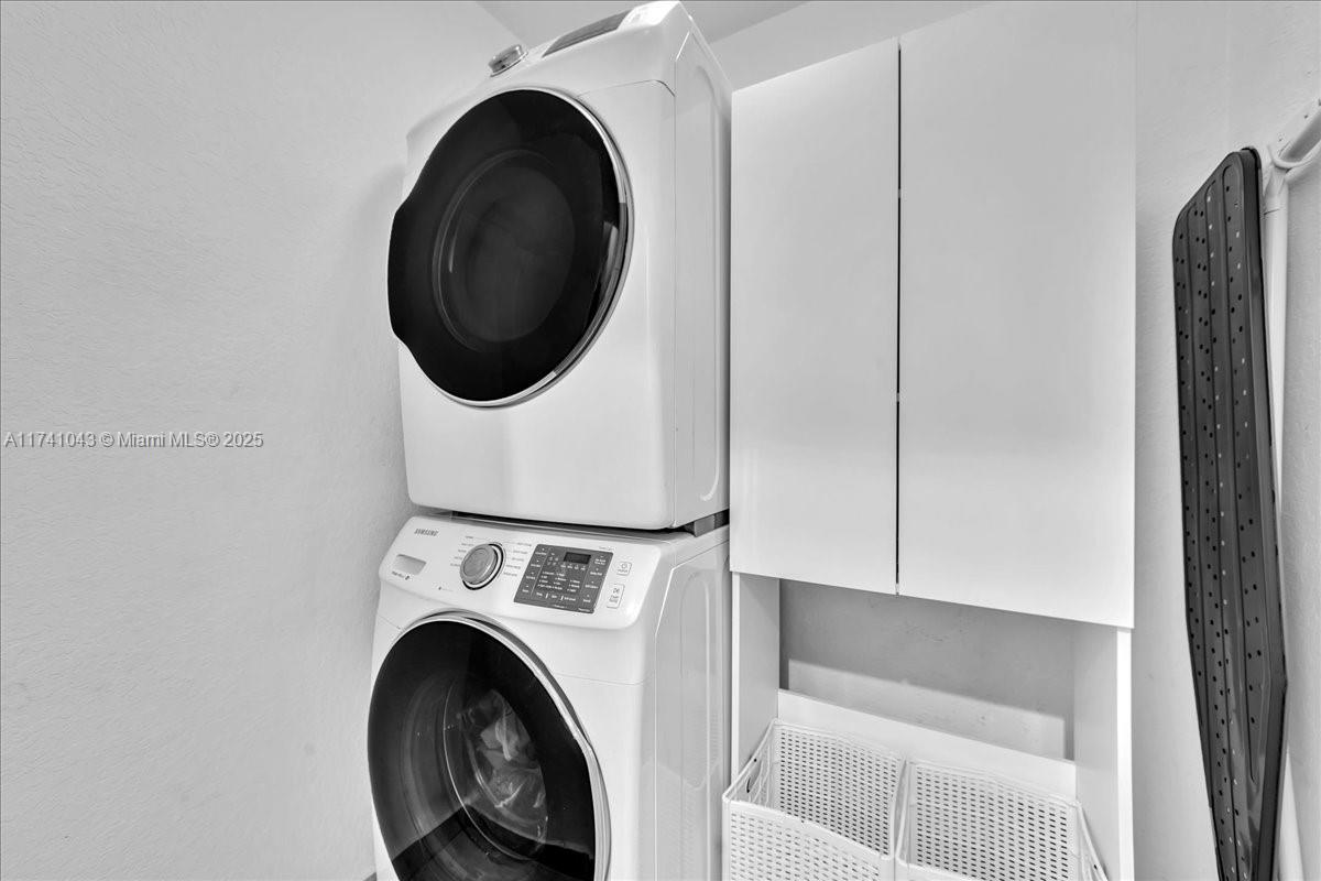 8381 Southwest 26 Th Street, Unit 103 Miramar, FL 33025 - Photo 42 of 62 a close view of a utility room with dryer and washer