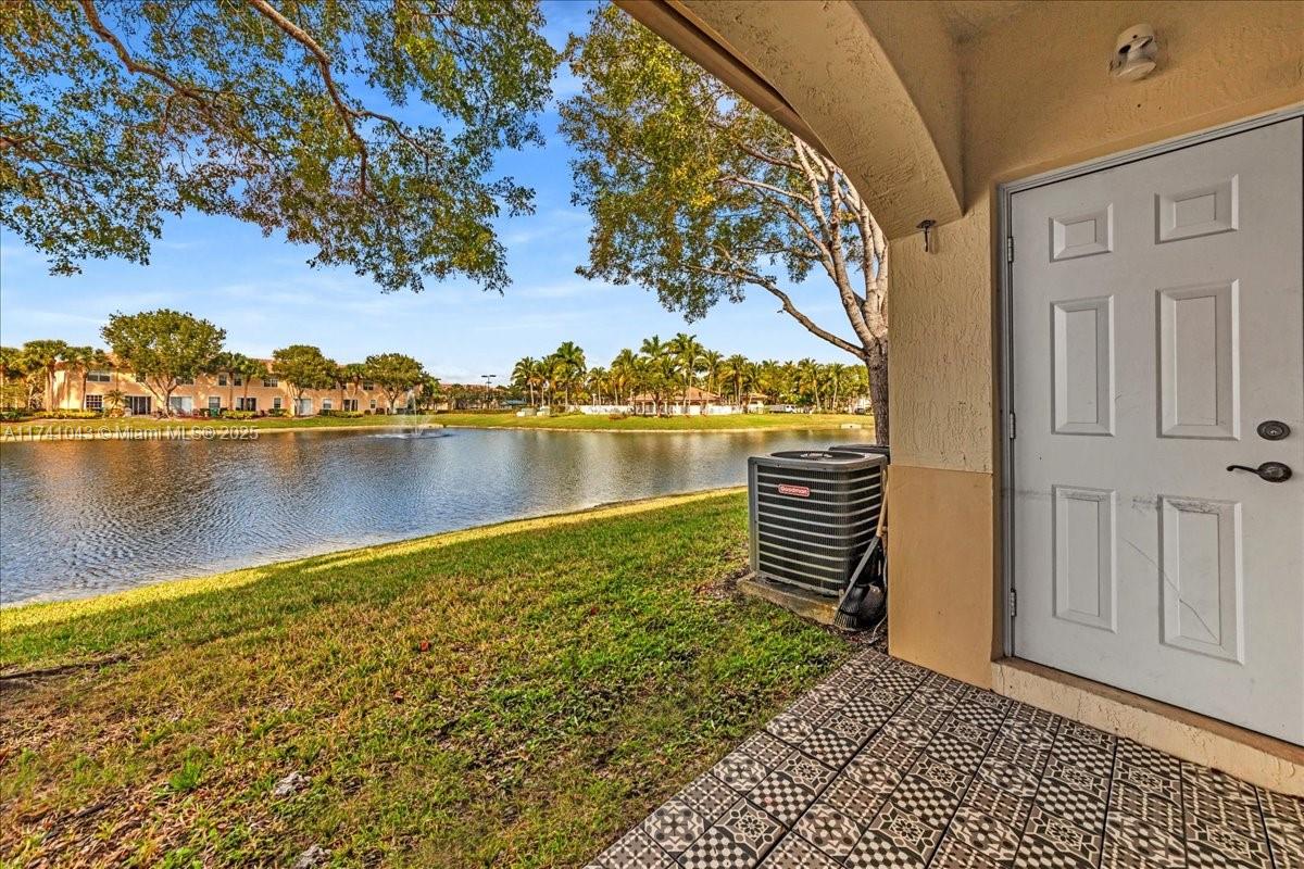 8381 Southwest 26 Th Street, Unit 103 Miramar, FL 33025 - Photo 43 of 62 a view of a lake with a mountain view