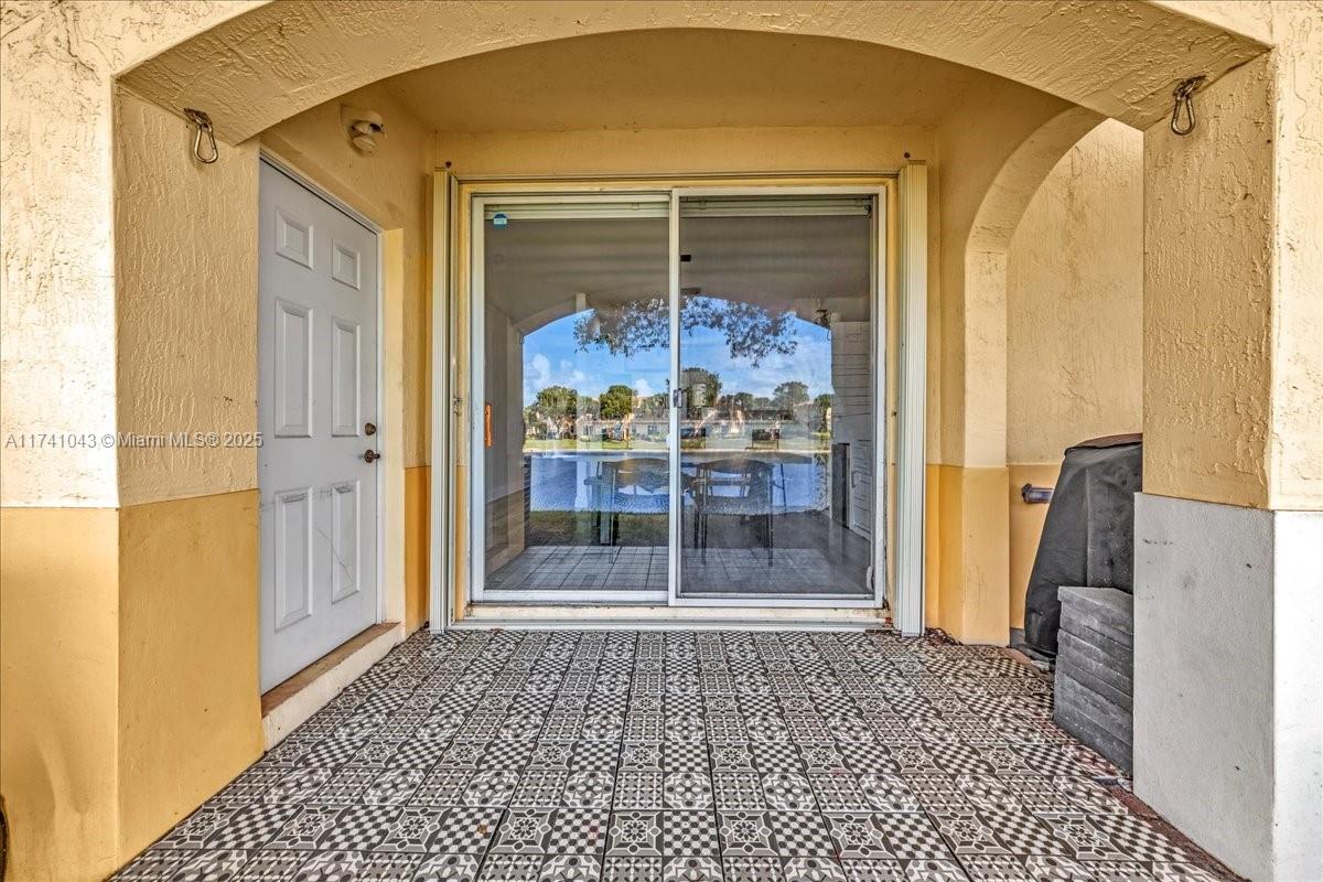8381 Southwest 26 Th Street, Unit 103 Miramar, FL 33025 - Photo 44 of 62 a view of a bathroom with a glass door