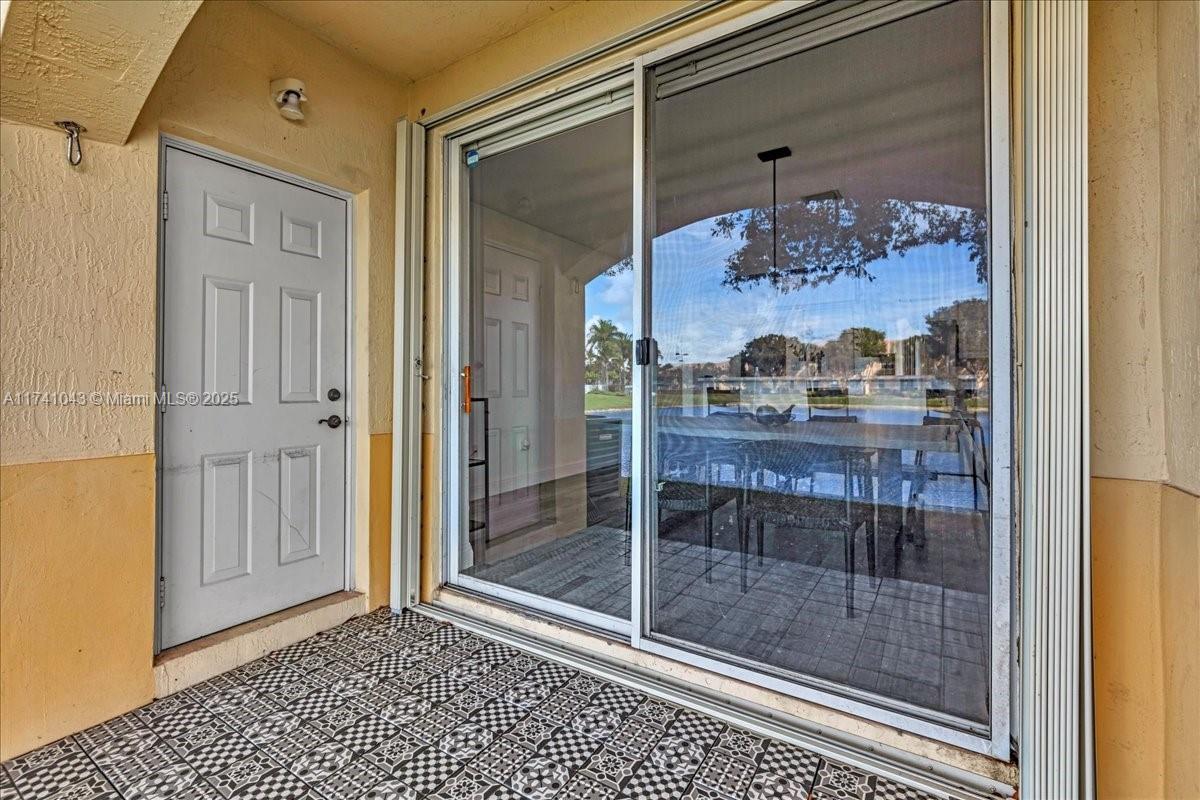 8381 Southwest 26 Th Street, Unit 103 Miramar, FL 33025 - Photo 45 of 62 a bathroom with a glass shower door