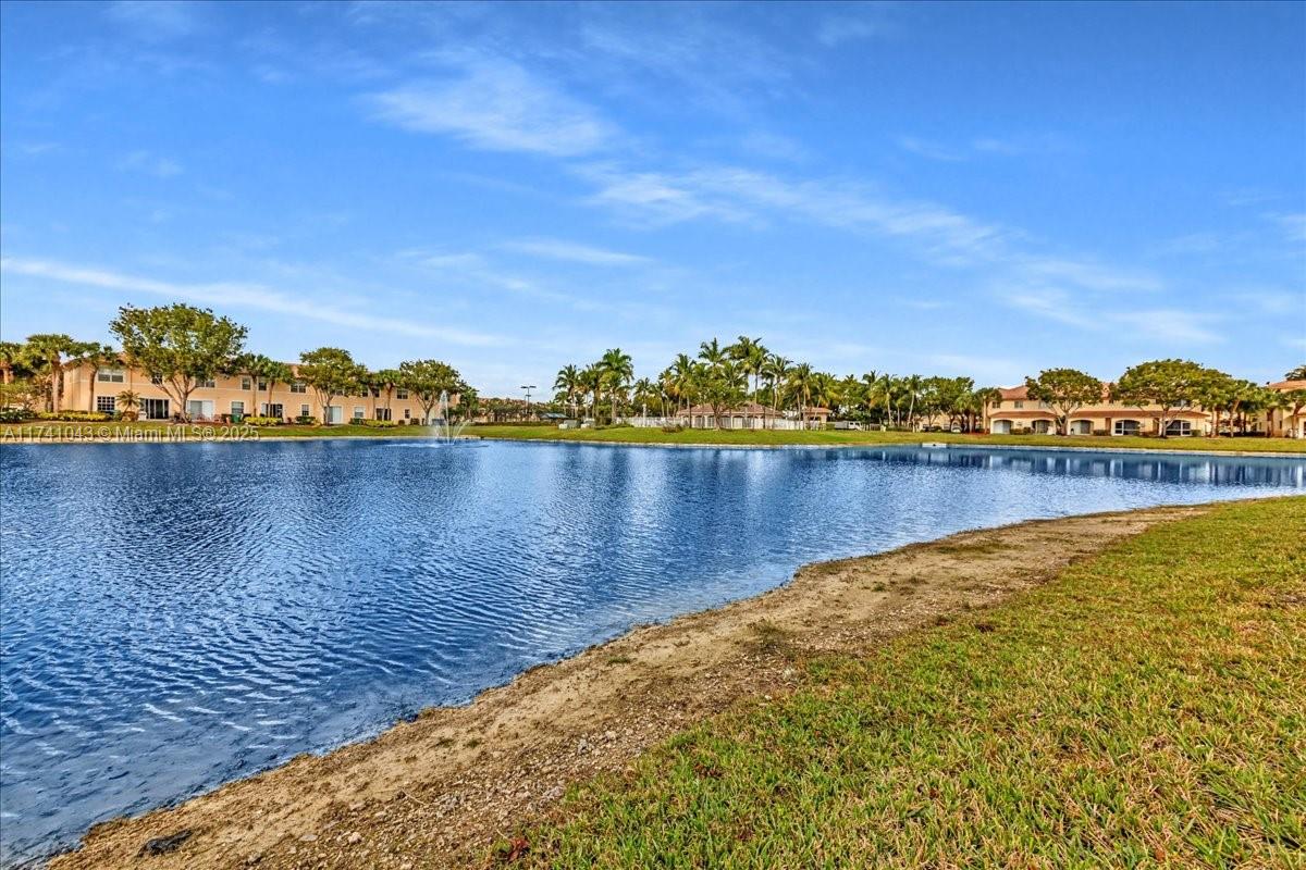 8381 Southwest 26 Th Street, Unit 103 Miramar, FL 33025 - Photo 49 of 62 a view of a lake with houses in the back