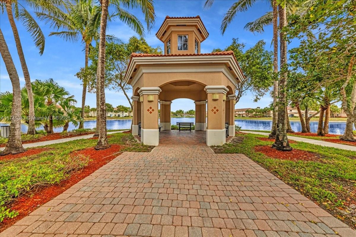 8381 Southwest 26 Th Street, Unit 103 Miramar, FL 33025 - Photo 55 of 62 a front view of a house with garden