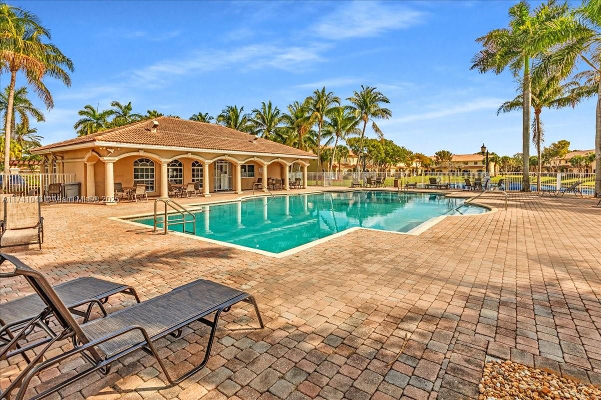 8381 Southwest 26 Th Street, Unit 103 Miramar, FL 33025 - Photo 56 of 62 a view of a house with a yard