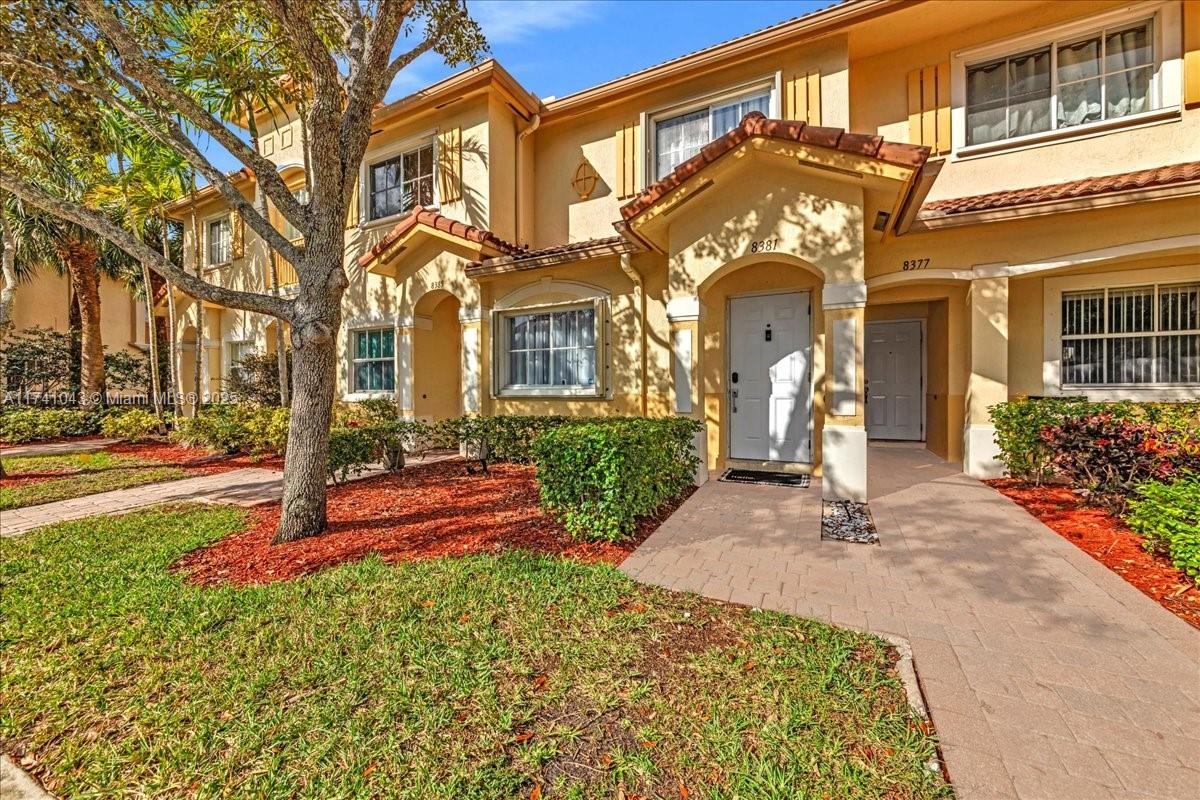 8381 Southwest 26 Th Street, Unit 103 Miramar, FL 33025 - Photo 61 of 62 a view of a building with a pathway
