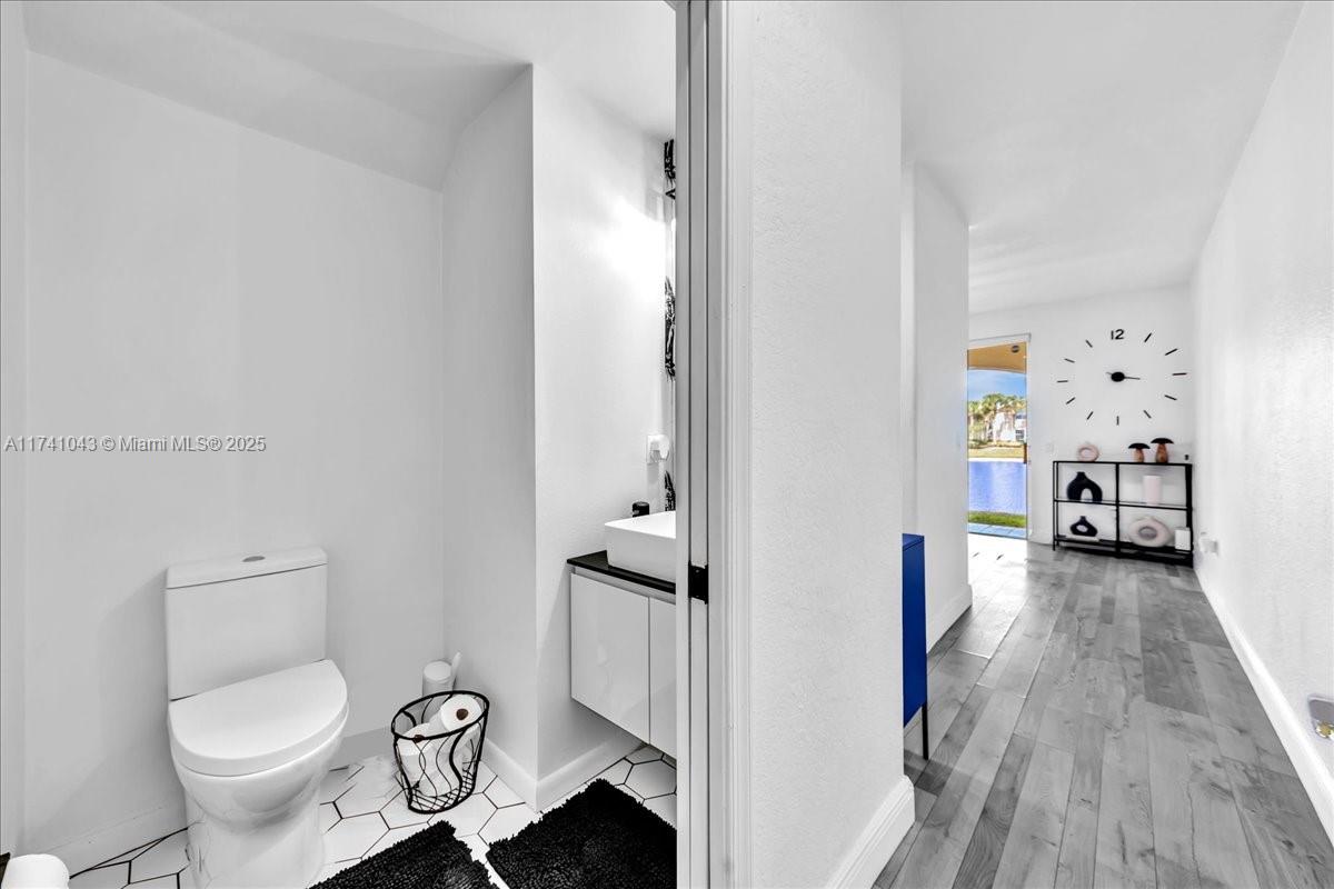 8381 Southwest 26 Th Street, Unit 103 Miramar, FL 33025 - Photo 9 of 62 a bathroom with a toilet and a shower