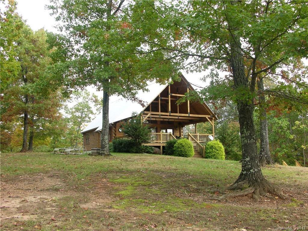 145 Spring Hill Ln Mill Spring, Unit 32 Mill Spring, NC 28756 - Photo 14 of 24 a front view of house with yard