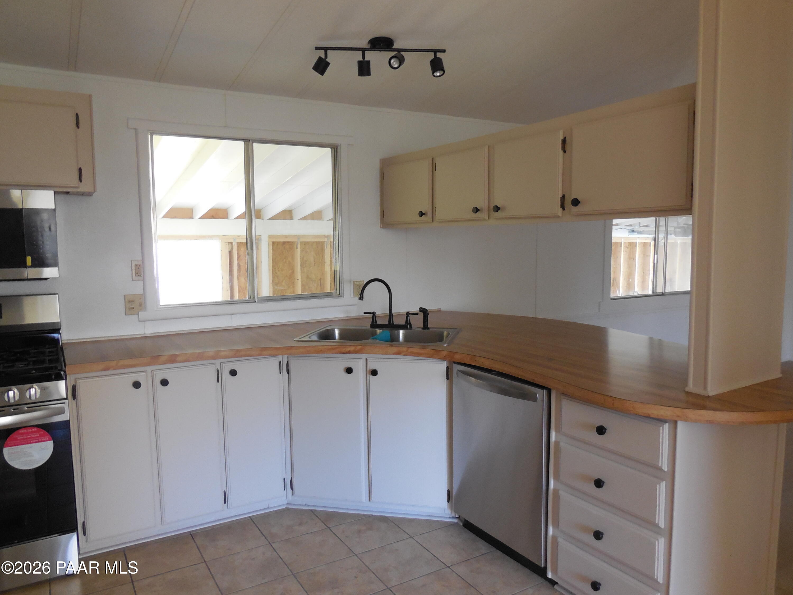 1145 Trinity Court Prescott, AZ 86301 - Photo 11 of 23 a kitchen with cabinets appliances a sink and a window
