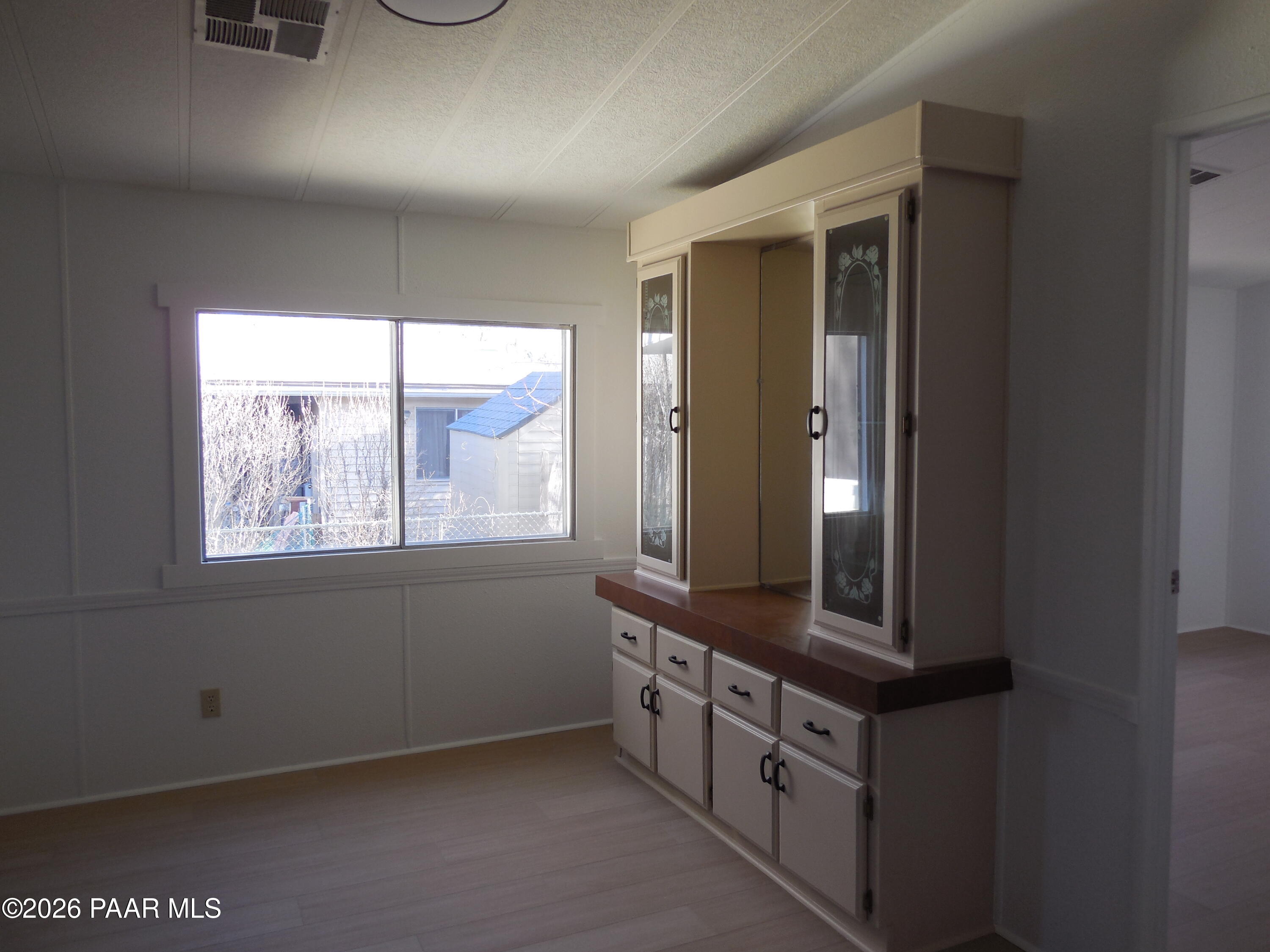 1145 Trinity Court Prescott, AZ 86301 - Photo 14 of 23 an empty room with windows and entrance