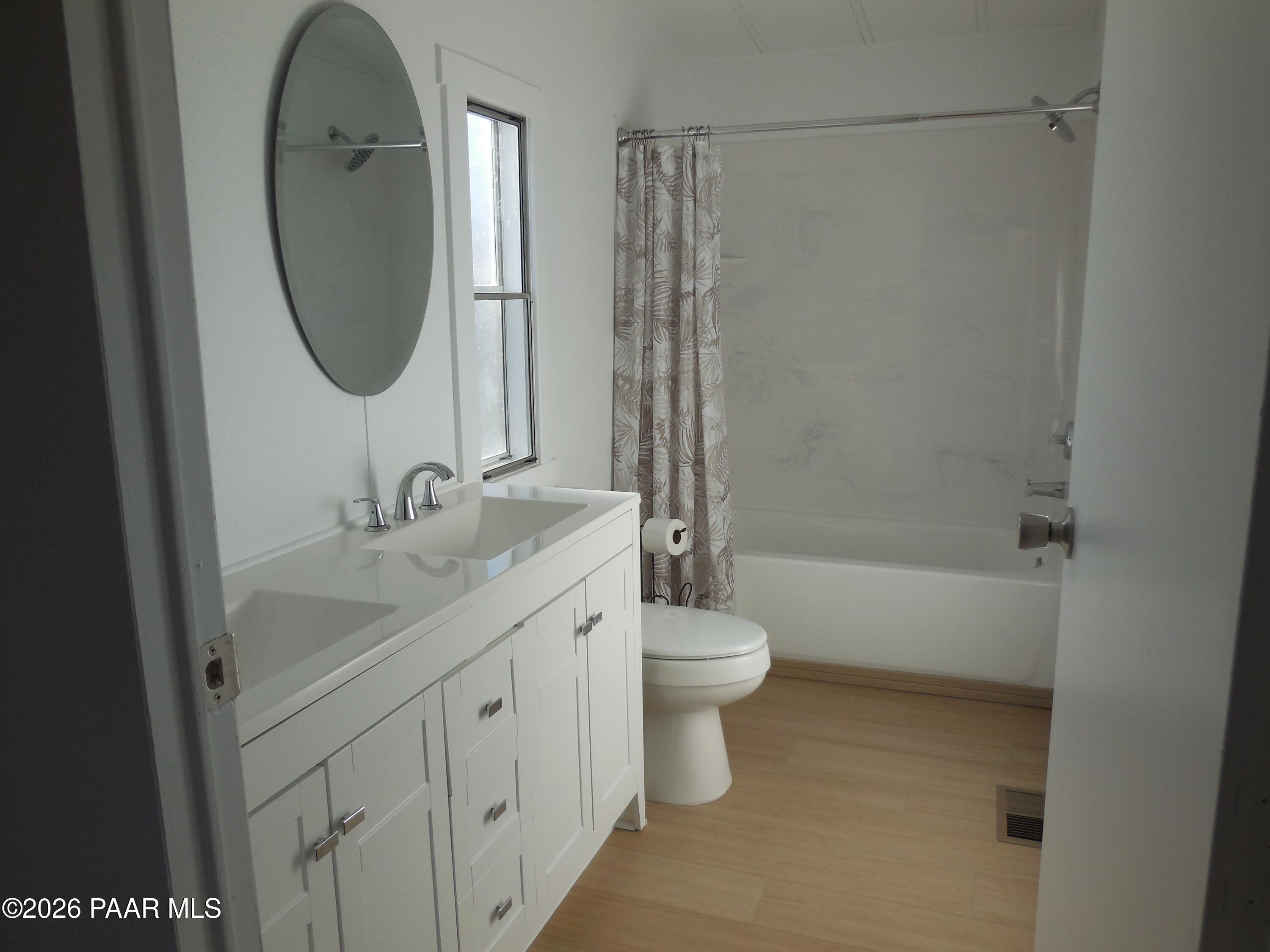 1145 Trinity Court Prescott, AZ 86301 - Photo 18 of 23 a bathroom with a toilet sink and a mirror