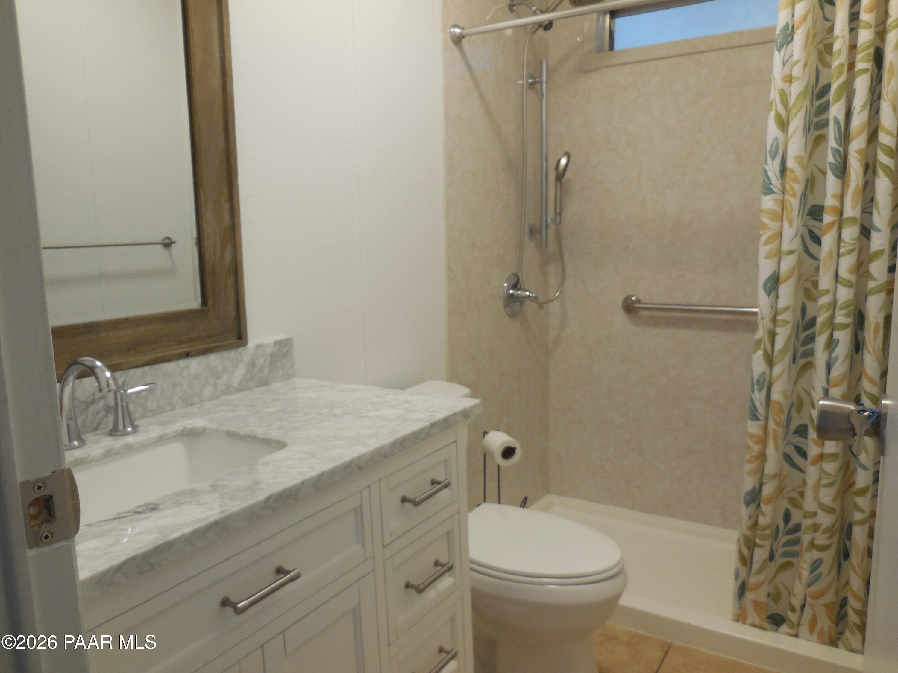 1145 Trinity Court Prescott, AZ 86301 - Photo 21 of 23 a bathroom with a granite countertop sink toilet and shower