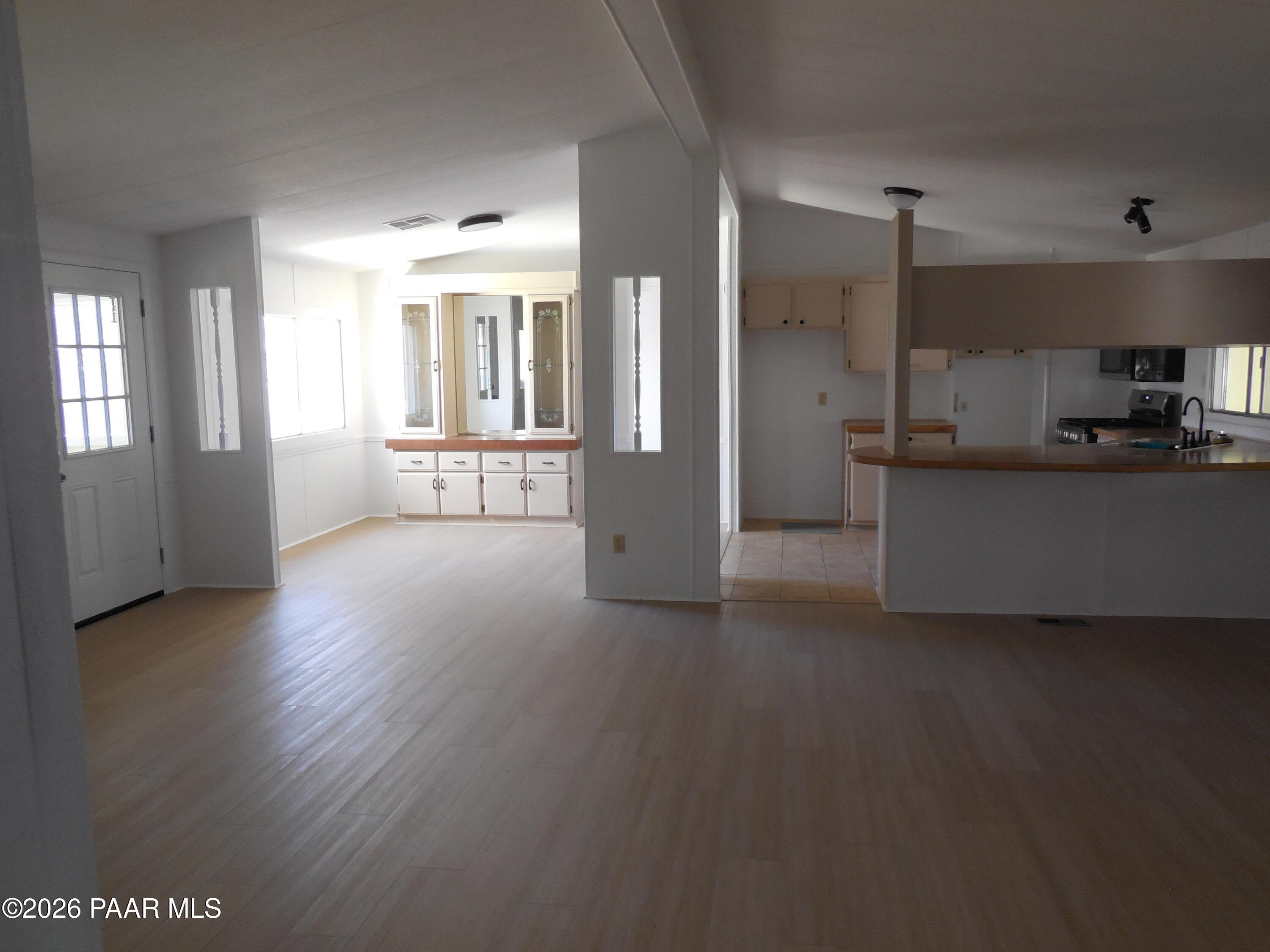 1145 Trinity Court Prescott, AZ 86301 - Photo 8 of 23 a view of a kitchen with a sink and a large window